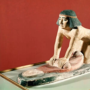 Model of a woman grinding grain, Old Kingdom (polychrome stone)