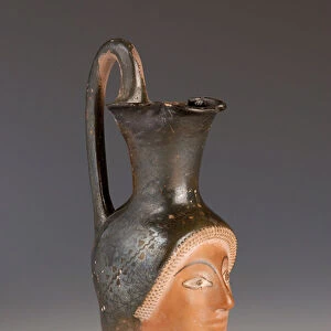 Oenochoe in the form of a female head (terracotta)