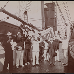 Officers and crew toasting with champagne and cigars on the deck of the S. S