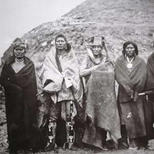Pawnee people in front of a tribal earth lodge, c. 1869 (b / w photo)