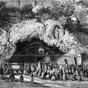 Pelerins in front of the miraculous cave of Lourdes in the High Pyrenees where the Virgin