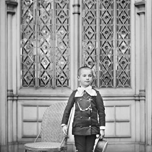 Portrait of a child of the bourgeoisie of Chaumont en Haute Marne, posing in the Abbey of Septfontaine. Photography around 1886 by Paul Emile Theodore Ducos (1849-1913)