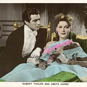 Robert Taylor, American actor and Greta Garbo, Swedish-American actress in a scene from the film Camille (coloured photo)