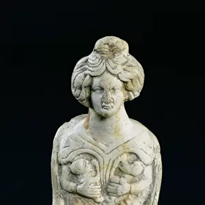 Statuette of a mother goddess breastfeeding two children (white terracotta)