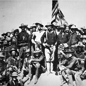 A triumphant Theodore Roosevelt with his Rough Riders at San Juan Hill, Cuba