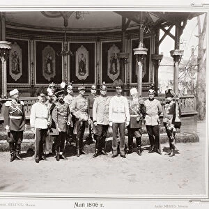 Tsar Nicholas II (1868-1918) standing in the garden pavilion of the Palace with a group