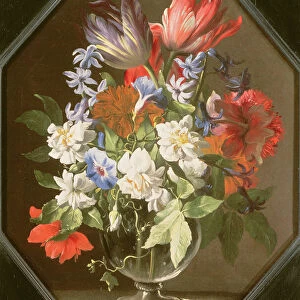 A Vase of Flowers on a Stone Ledge Containing Tulips, Chrysanthemums, Dahlias and Narcissi