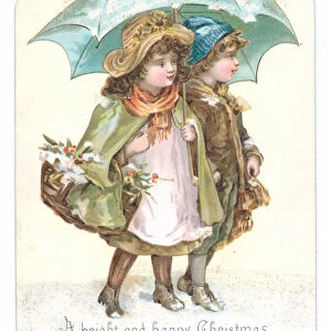 A Victorian Christmas card of two girls with baskets on their arms under an umbrella, c