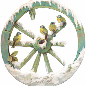 A Victorian Die-cut Shape card of birds perched on a snow covered wheel, c