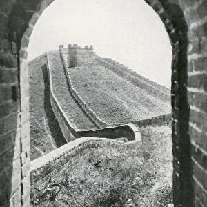 View along the Great Wall through an arch in one of the Watch Towers (b / w photo)