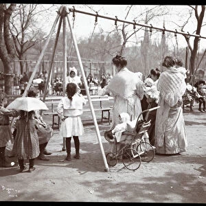 Women and children at the swings on Arbor Day, Tompkins Square Park, New York
