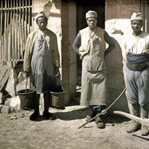 Three workers from Senegal in front of a house, Soissons, Aisne, France