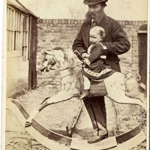 Young girl on a rocking horse in the garden, her father beside, 1860s (albumen print)