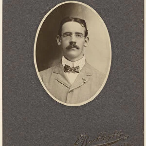 man moustache wearing wire-rimmed glasses Buckley & Company