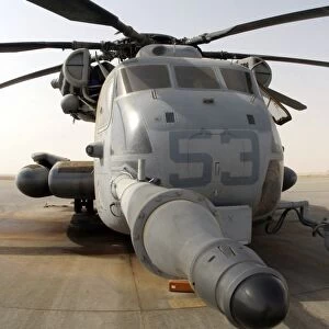 A CH-53E Super Stallion helicopter sitting on the flight line at Al Asad Air Base, Iraq