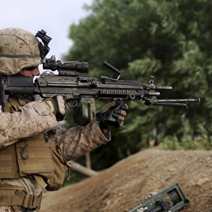 U. S. Marine provides security with an M249 Squad Automatic Weapon