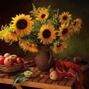 Still life with sunflowers and apples