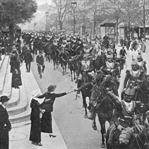 French cuirassiers riding through the streets of Paris on their way on the front, 1914