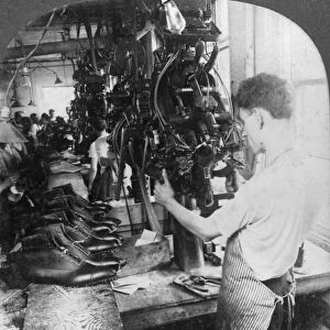 Lasting machine shaping shoes in shoe factory, Lynn, Massachusetts, USA, early 20th century(?). Artist: Keystone View Company