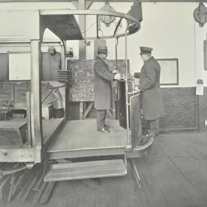 Learner-driver under instruction in a mock-up of tram car cab, London, 1932