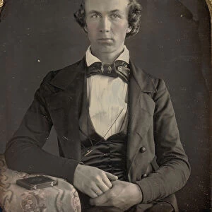 Seated Young Man Resting Arm on Table Beside Daguerreotype Case, 1840s. Creator: Unknown