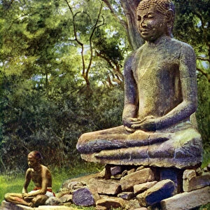 Stone Buddha, a relic of the past glory of Anuradhapura, Ceylon, c1924