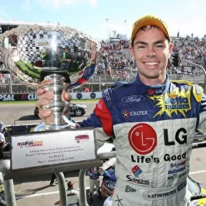 2006 Australian V8 Supercars Clipsall 500, Adelaide, Australia. 25th - 26th March 2006. Race One winner Craig Lowndes (Team Betta Electrical Ford Falcon BA) with champagne and trophy. World Copyright: Mark Horsburgh/LAT Photographic ref