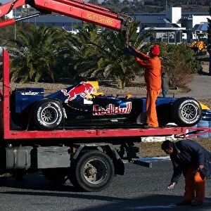 Formula One Testing: The car of David Coulthard Red Bull Racing RB2 is picked up by a truck