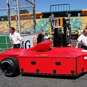 Formula One World Championship: A car is squeezed through the pit wall