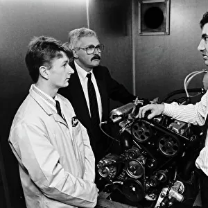 A young Allan McNish visits his new sposors, Gates of Dumfries, with Manager Robert Denholm (left) and Development Engineer Fraser Lacey (Right). Portrait. Ref: B/W Print