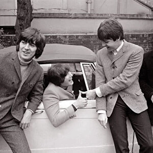 The Beatles by John Lennons car after he passed his L-test 15th February 1965