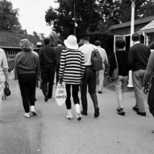 Beaulieu Jazz Festival. A young girl in a striped sweater carries a notice saying "