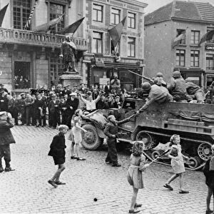 Belgian people go wild with excitement as the first American troops roll in to Soignies