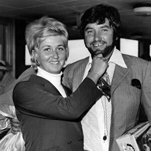 Comedian Jimmy Tarbuck flew into London airport today sporting a beard