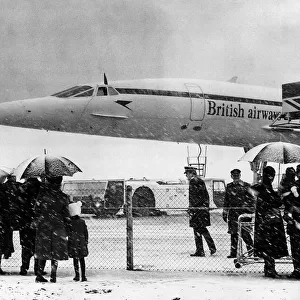 Concorde about to leave Heathrow airport in the snow with the Queen