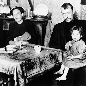Family living in the slums of East London December 1910