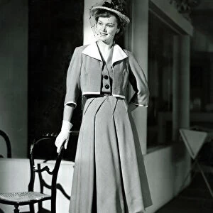 Fashion 1940s Model wearing a Bolero Pleated skirt suit