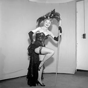 Show girl wearing star spangled costume and cane. Circa 1959