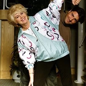 Gloria Hunniford Radio 2 DJ with star of Eastenders and Heart Beat Nick Berry Exercising