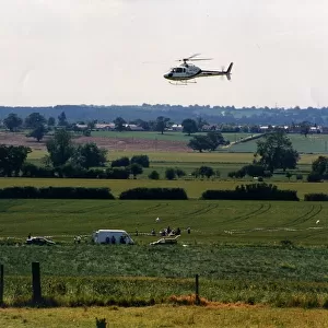 A helicoper hovers over a field at Studley Grange, Warwickshire during the making of TV