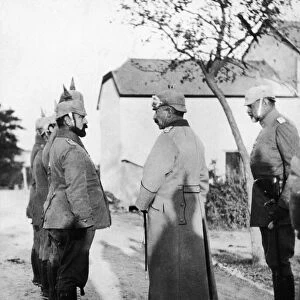 Kaiser Wilhelm II seen here inspecting a group of army doctors in a village close to