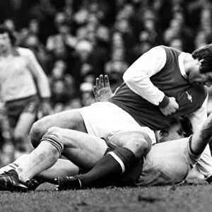 Malcolm McDonald Football Player of Arsenal - is about to punch Kevin Beattie of