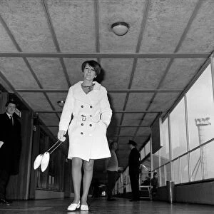 Mary Quant at London Heathrow Airport on her way to Copenhagen, wearing a short coat
