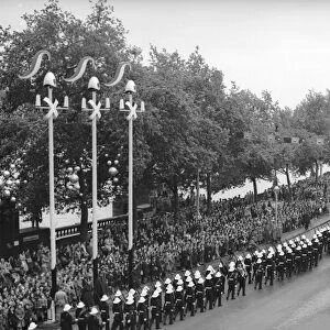 Members of the Royal Marines march down Victoria Embankment accompanying the Queen