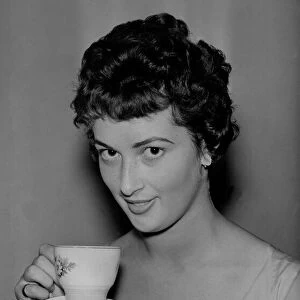 A model enjoying a cup of tea on 6th August 1959 for an Evening Chronicle tea feature