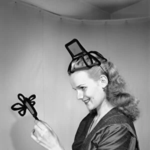 Model Hilda Moray wearing unusual Easter bonnet. March 1953