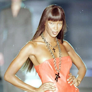 Naomi Campbell modelling an orange / peach bodice Mar 1999 with trail for designer Rocco