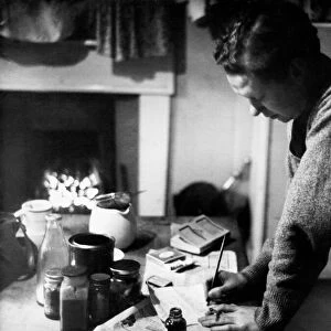 Poet Dylan Thomas pictured at his flat in Chelsea, London, 1945