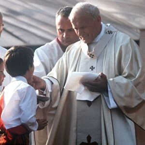 Pope John Paul II gives Holy Communion at Bellahouston Park in Glasgow, Scotland