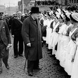 Prime Minister Winston Churchill accompanied by the Mayor and Alderman JA Mosely